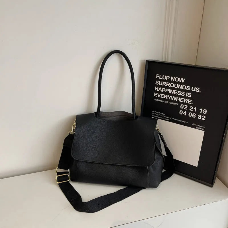 PU leather tote bag with a horizontal square shape and double shoulder straps in a neutral colour