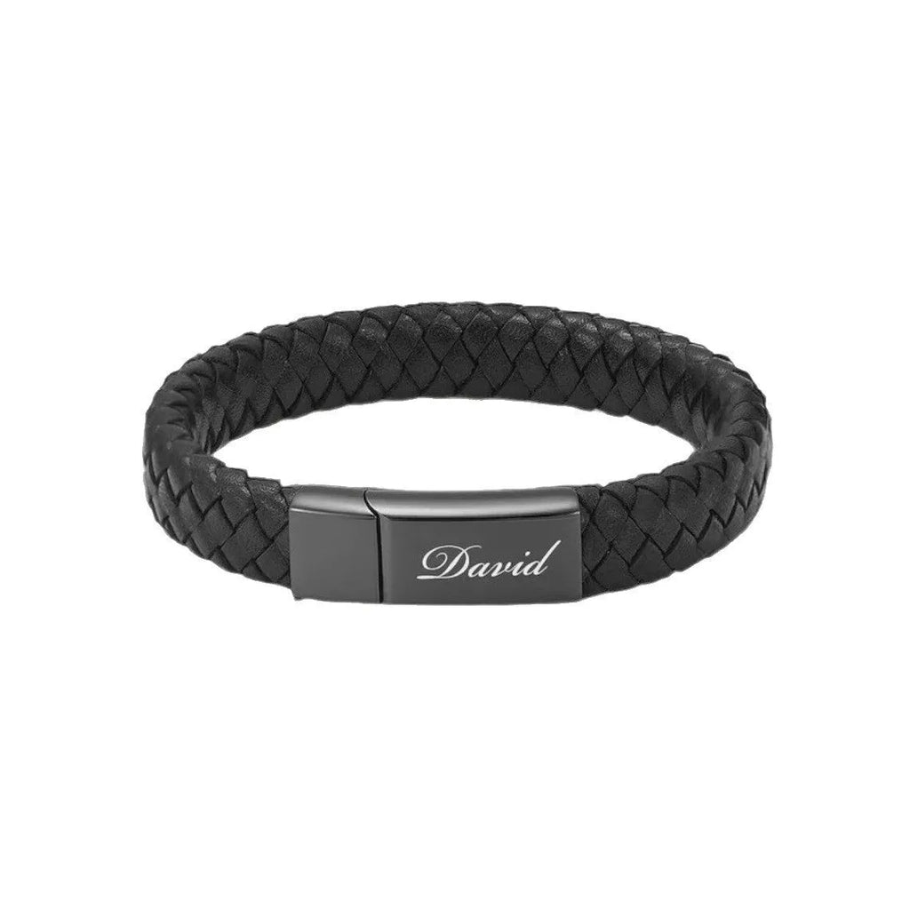 Men's black leather and stainless steel casket bracelet with engraving option on a gift box.