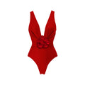 Red women's V-neck one-piece swimsuit with detachable flower and matching skirt on a mannequin