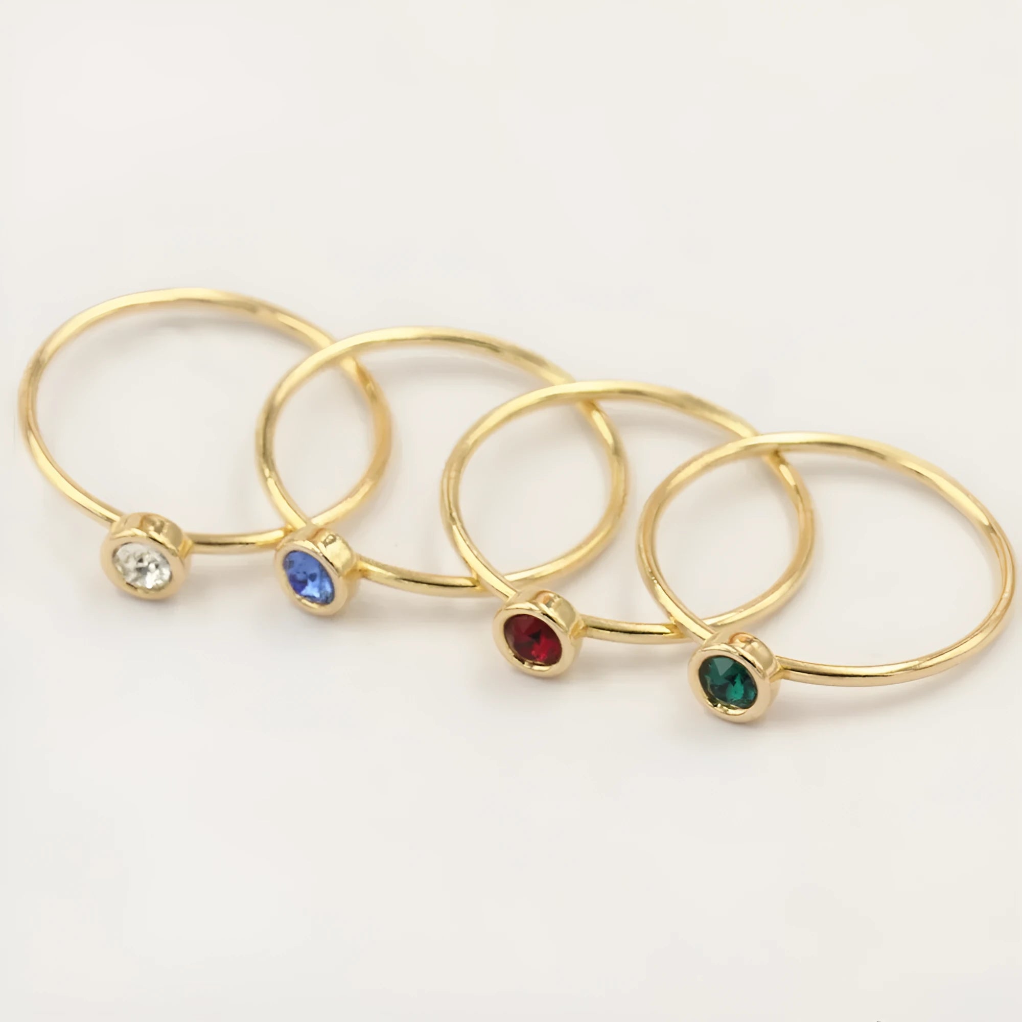 14K gold gilded brass knuckle ring with zircon stones in green blue dark red white colours
