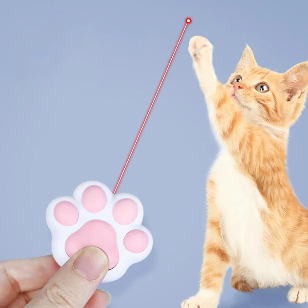 Pink and black infrared cat teaser toy with USB charging port measuring 5 by 2.5 centimetres