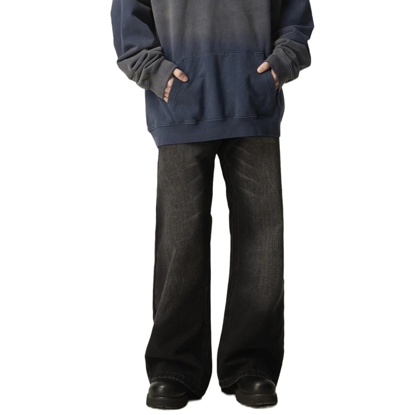 Black loose straight leg retro jeans on a hanger showing zipper fly detail