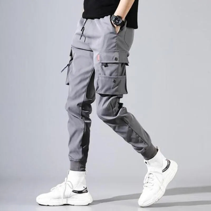 Men's cotton-polyester sports overalls in black with embossed finish and printed details, side view