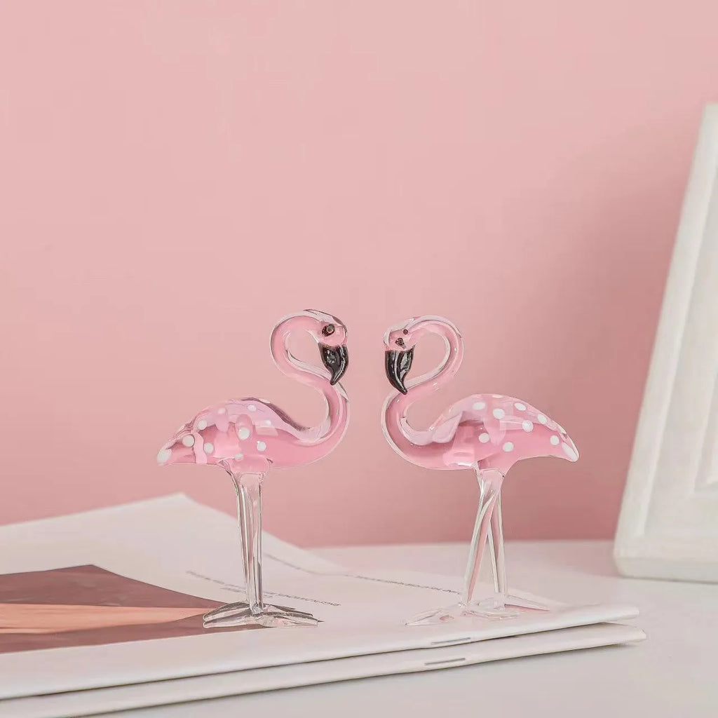 Pink crystal flamingo decorative sculpture on a table, modern simple style.