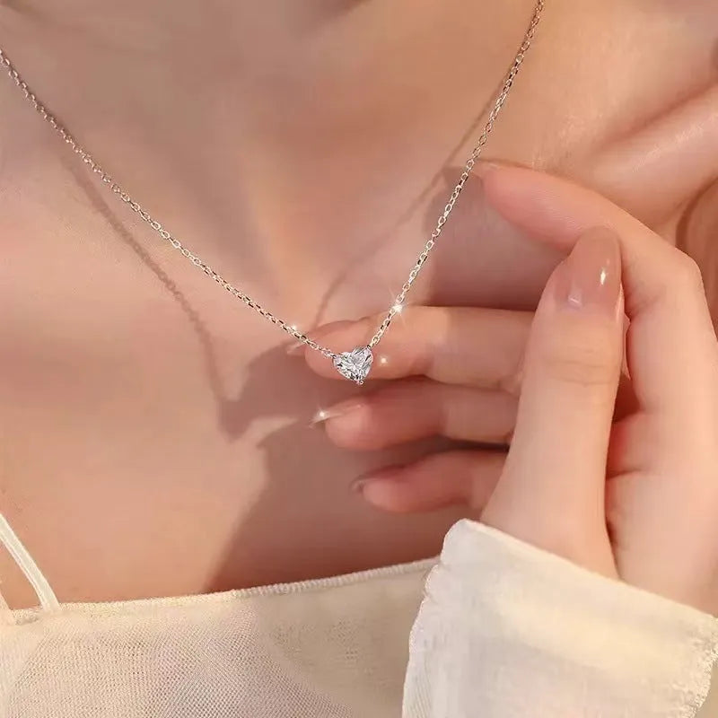Women's silver heart necklace with minimalist refined grace design on copper pendant