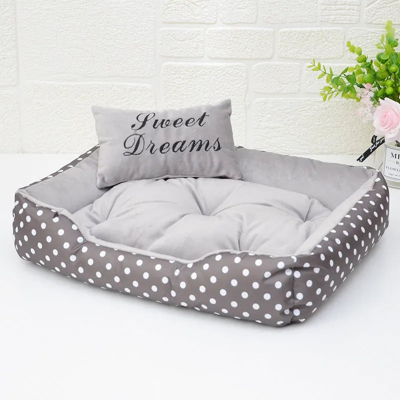 Polka dot printed dog bed with matching square pillow in grey, blue, pink or red colours