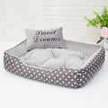 Polka dot printed dog bed with matching square pillow in grey, blue, pink or red colours