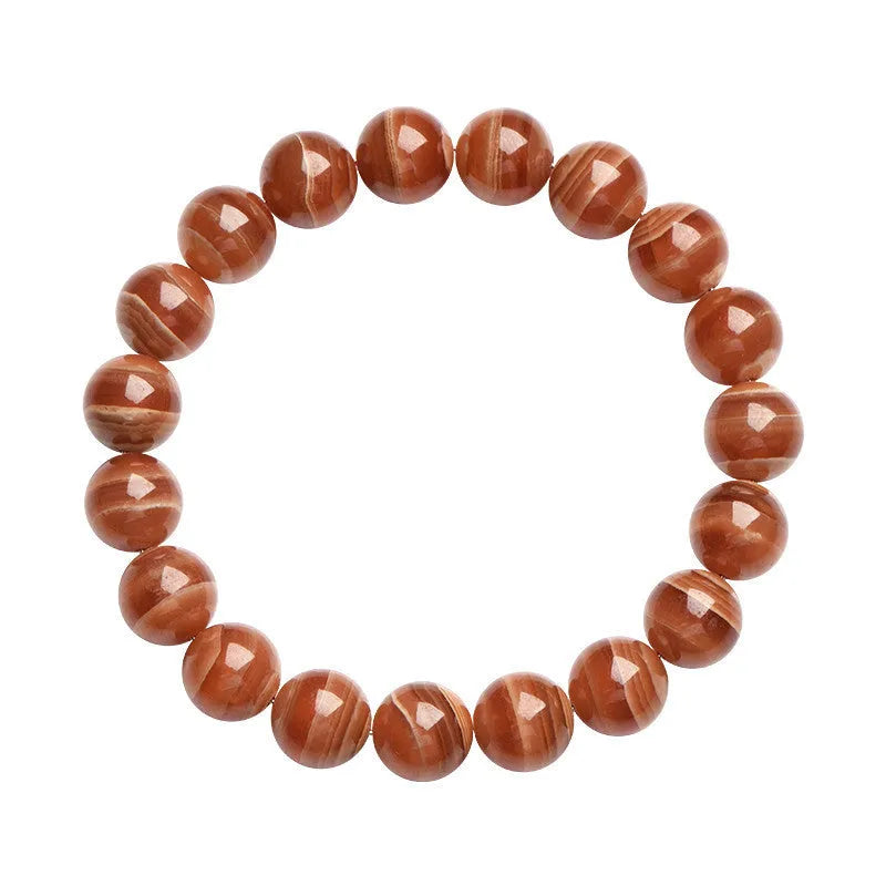 Peruvian rhodochrosite bracelet with geometric round beads in traditional ruyi design