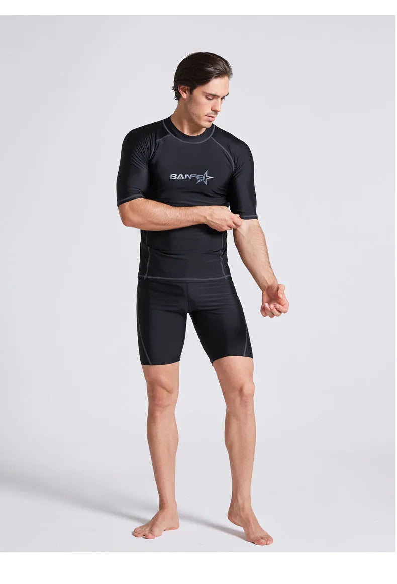 Men's quick-drying half sleeve swim top and pant set in nylon fabric on a white background.