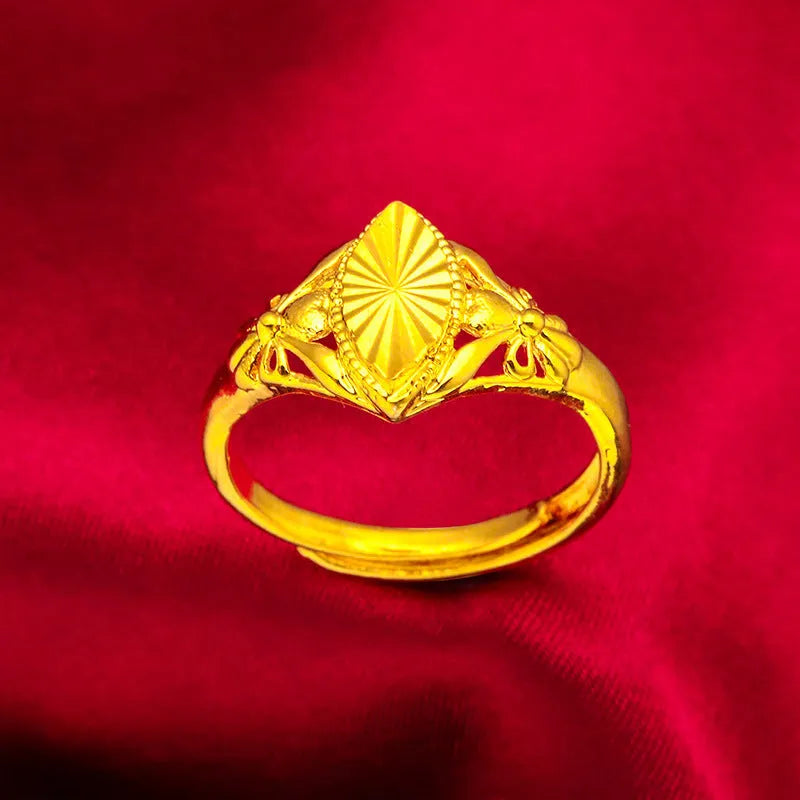 Gold-coloured brass flower ring with geometric texture and open diamond shape design