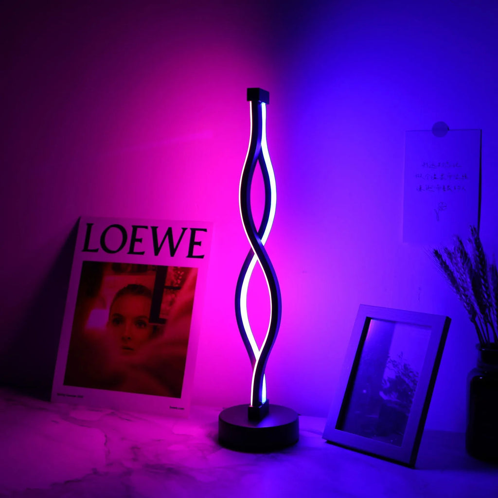 Black aluminium desk lamp with touch dimming buttons showing blue and pink controls