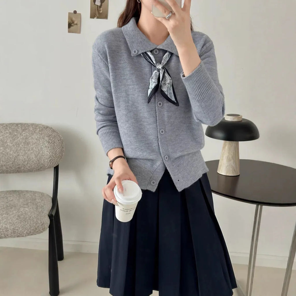 Beige lapel scarf collar cardigan sweater with long sleeves on a hanger