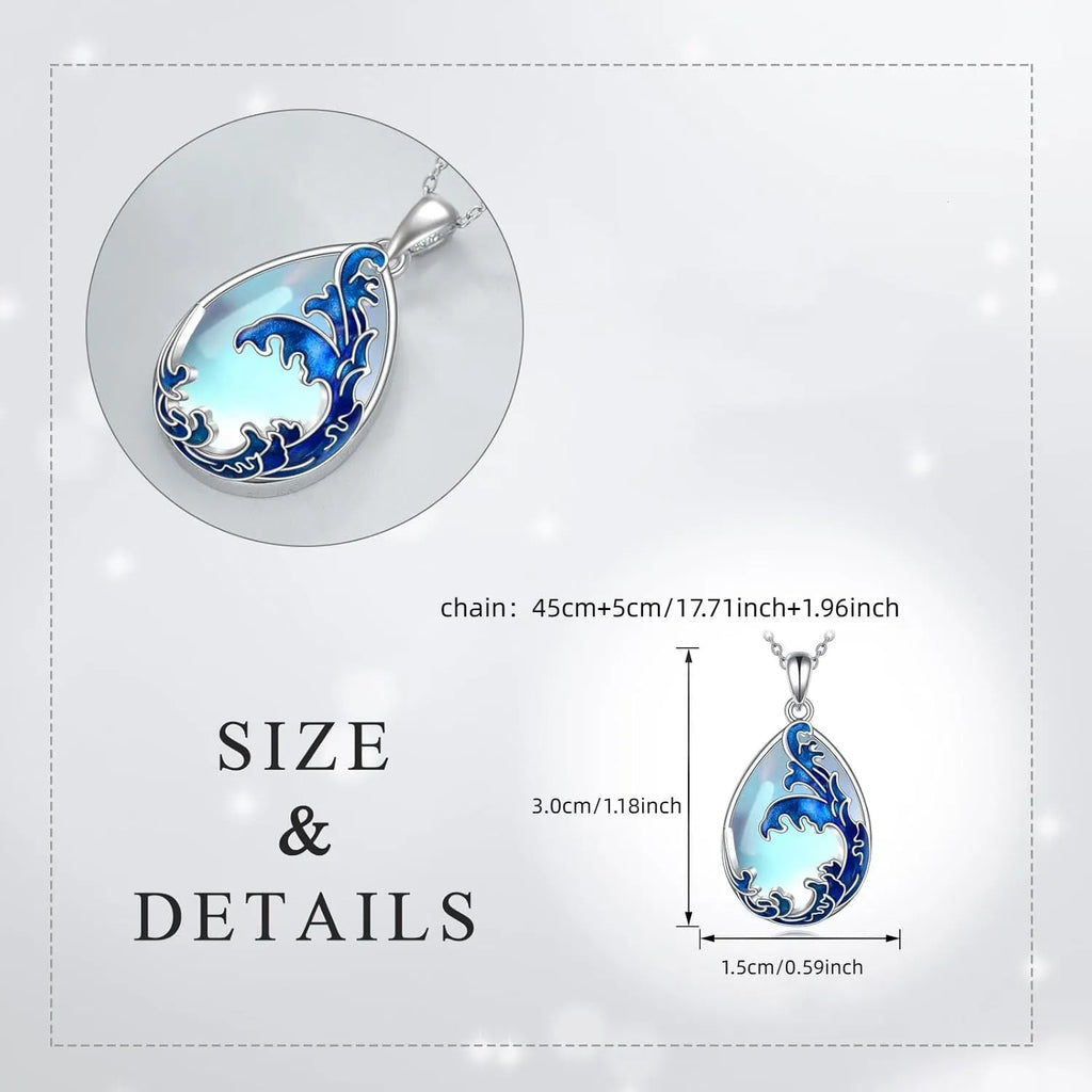 Blue heart pendant necklace on silver-tone chain with moonstone blue finish