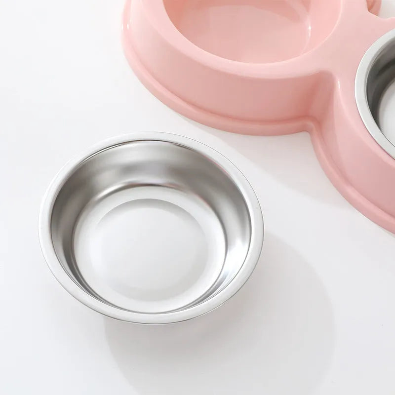 Stainless steel frog-shaped double pet bowl for food and water, available in blue, green, or pink.