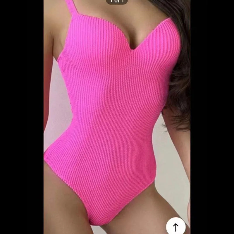 Women's black sunken stripe one-piece swimsuit made from polyester fabric, shown sleeveless.