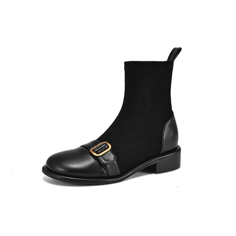 Women's black low-heel Martin ankle boots with buckle stitching and lace-up front.