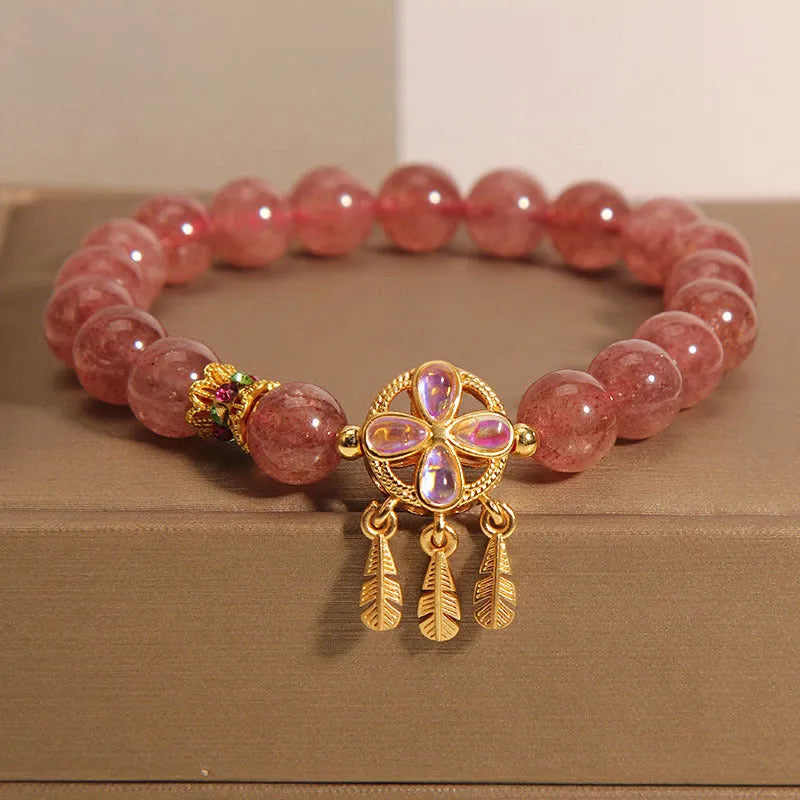 Women's strawberry quartz bracelet with four-leaf clover dream catcher ball pendant on adjustable leather cord