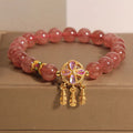 Women's strawberry quartz bracelet with four-leaf clover dream catcher ball pendant on adjustable leather cord