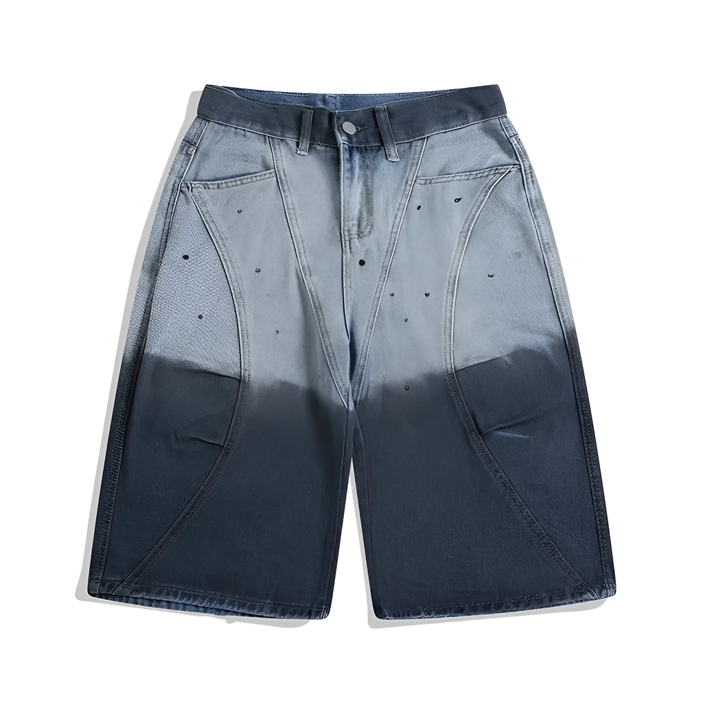 Loose fit blue tie-dye gradient cropped jeans on a hanger, showing washed-out colour and mid-waist design.