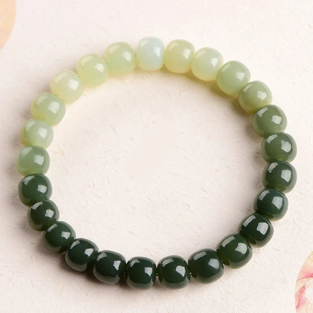 Natural Hetian jade water gradient bracelet with polished beads in clear tones