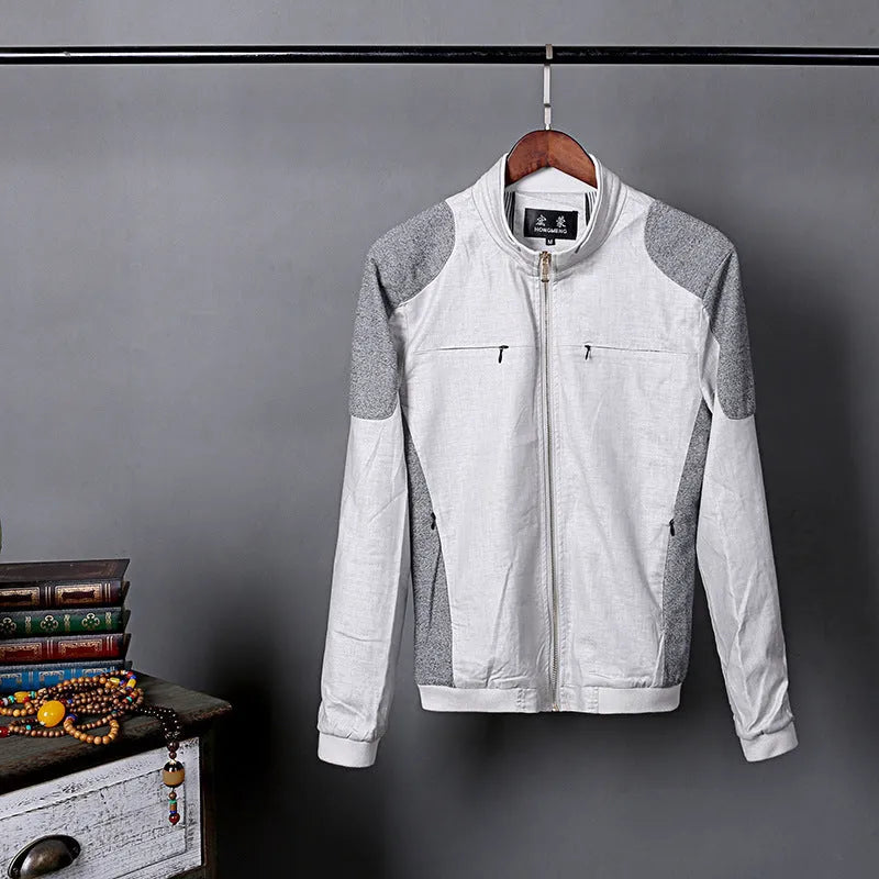 Men's thin blue cotton linen jacket on a hanger, showing regular cut and front button design.