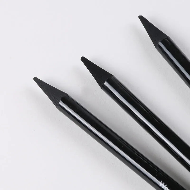 Set of six graphite pencils and three carbonized drawing pencils with wooden casings on a blister card.