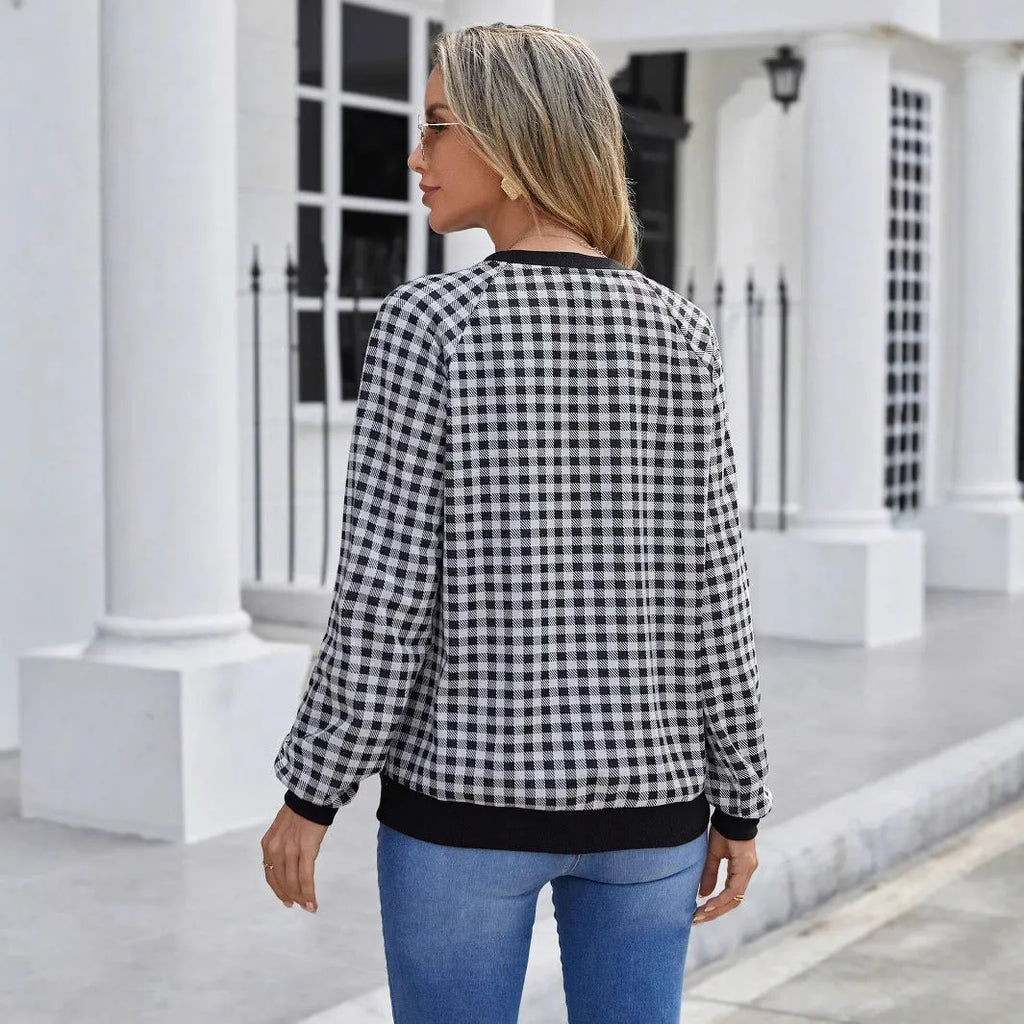 Black plaid striped long sleeve pullover sweater with printed design elements