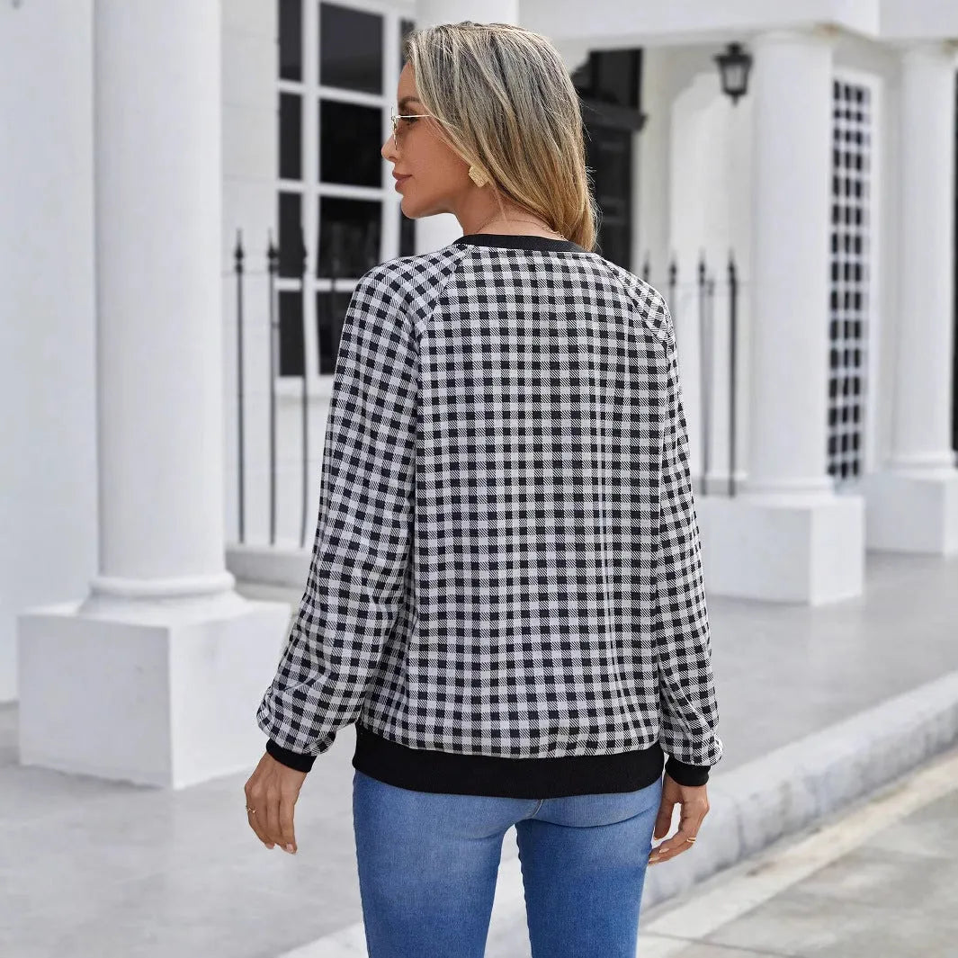 Black plaid striped long sleeve pullover sweater with printed design elements