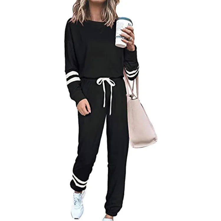 Women's plus size loose-fitting casual suit in a solid colour with long sleeves and matching trousers.