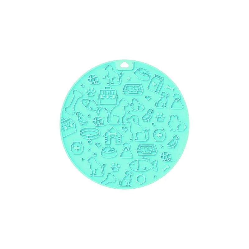 Round silicone pet lick mat with suction base in blue colour on tiled surface