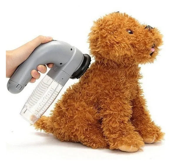 Grey handheld electric pet hair vacuum cleaner with soft rubber brush head for grooming dogs and cats