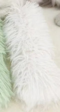 Green, white, blue, and pink plush cat toy pillow measuring 27cm by 10cm