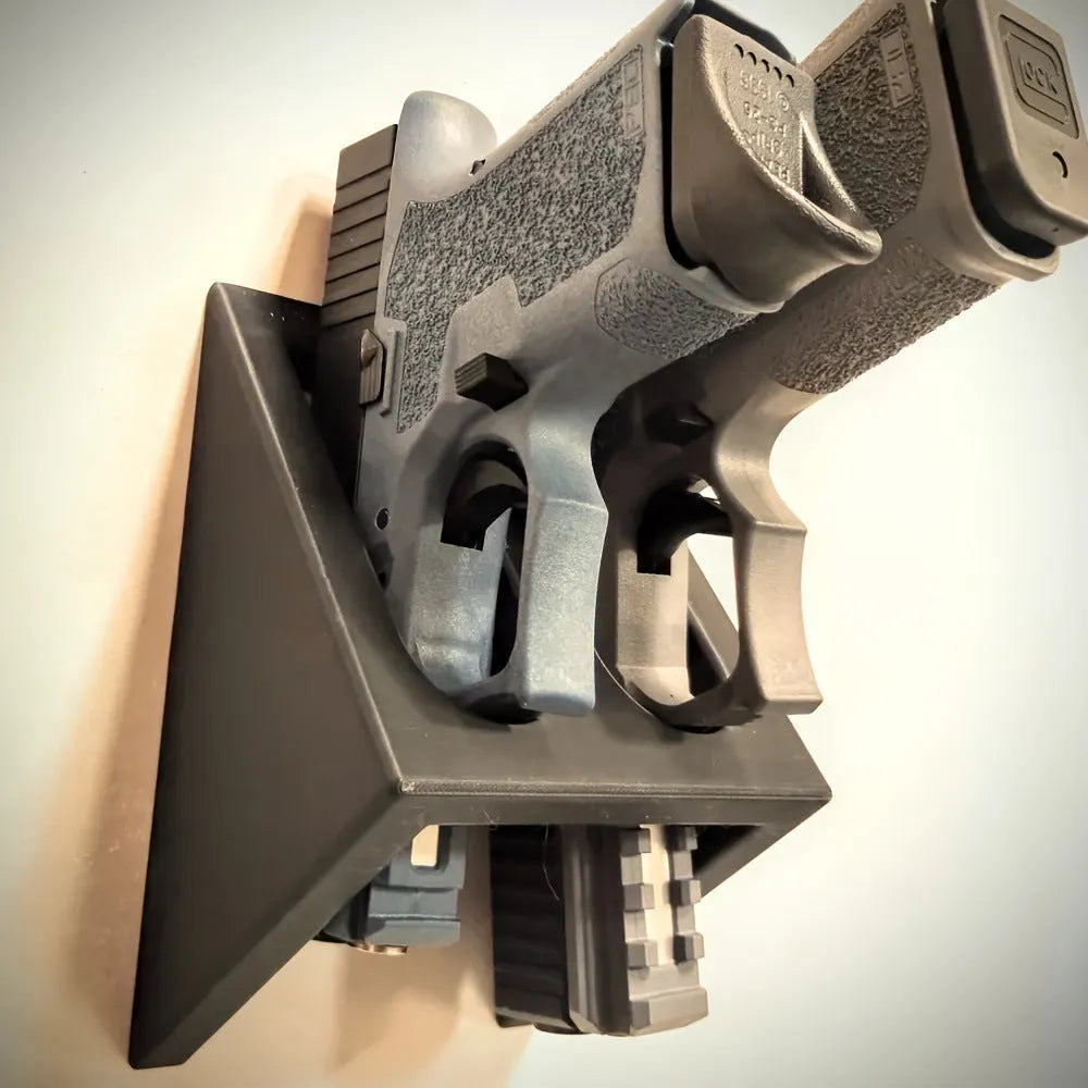 Black punk-style plastic pistol display stand for replica firearms