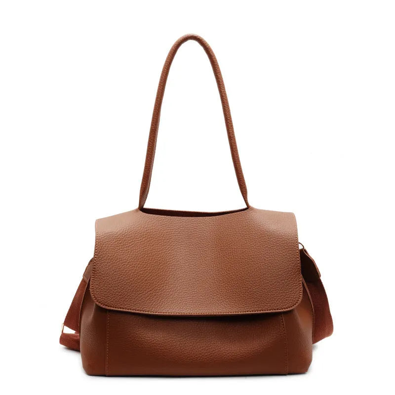 PU leather tote bag with a horizontal square shape and double shoulder straps in a neutral colour