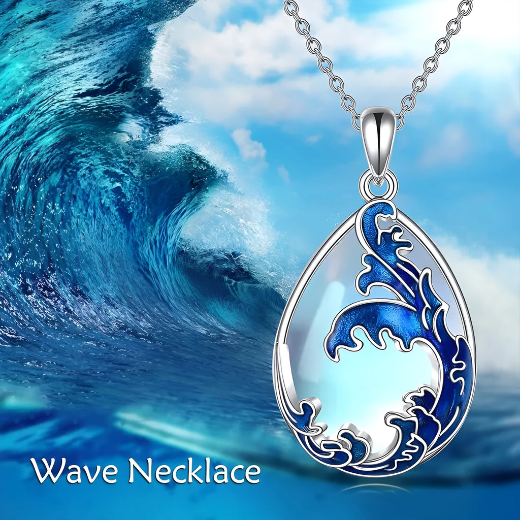 Blue heart pendant necklace on silver-tone chain with moonstone blue finish