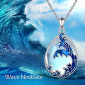 Blue heart pendant necklace on silver-tone chain with moonstone blue finish