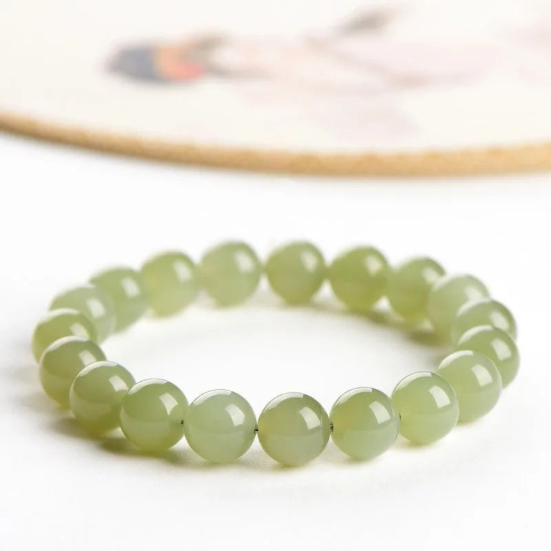 Polished Hetian jade bead bracelet showing deep water clear and light water clear colour options.