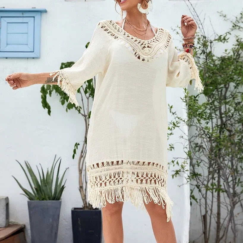 Apricot crocheted patchwork beach dress with half sleeves and mid-length skirt on hanger