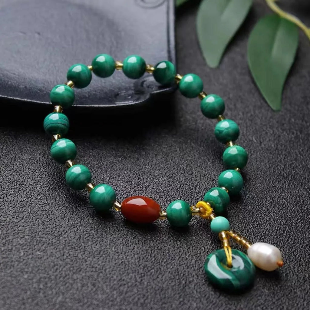 Natural malachite and red agate bracelet with 7-8mm barrel beads on wrist