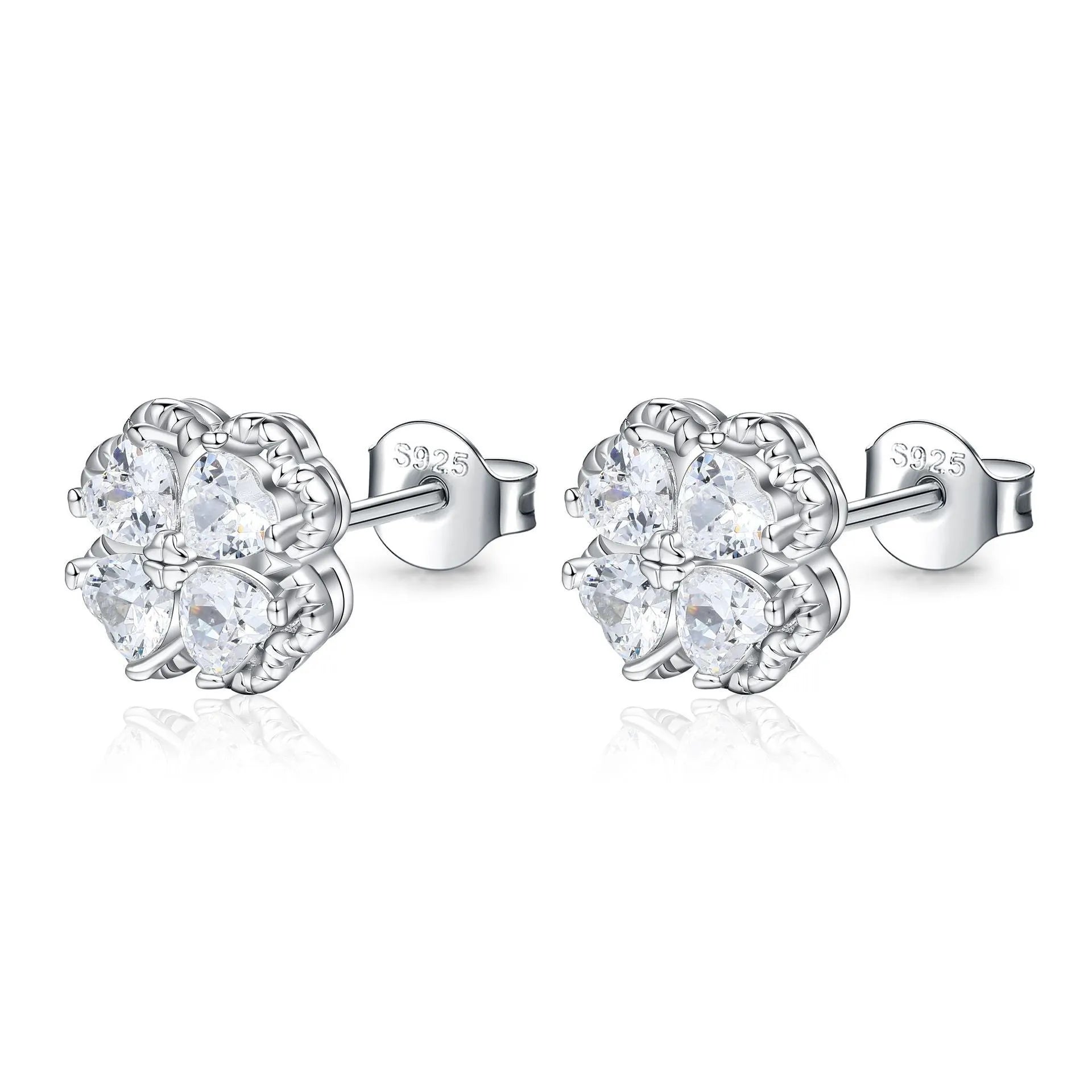 Pair of heart-shaped sterling silver earrings with four-leaf clover design and white gold colour finish.