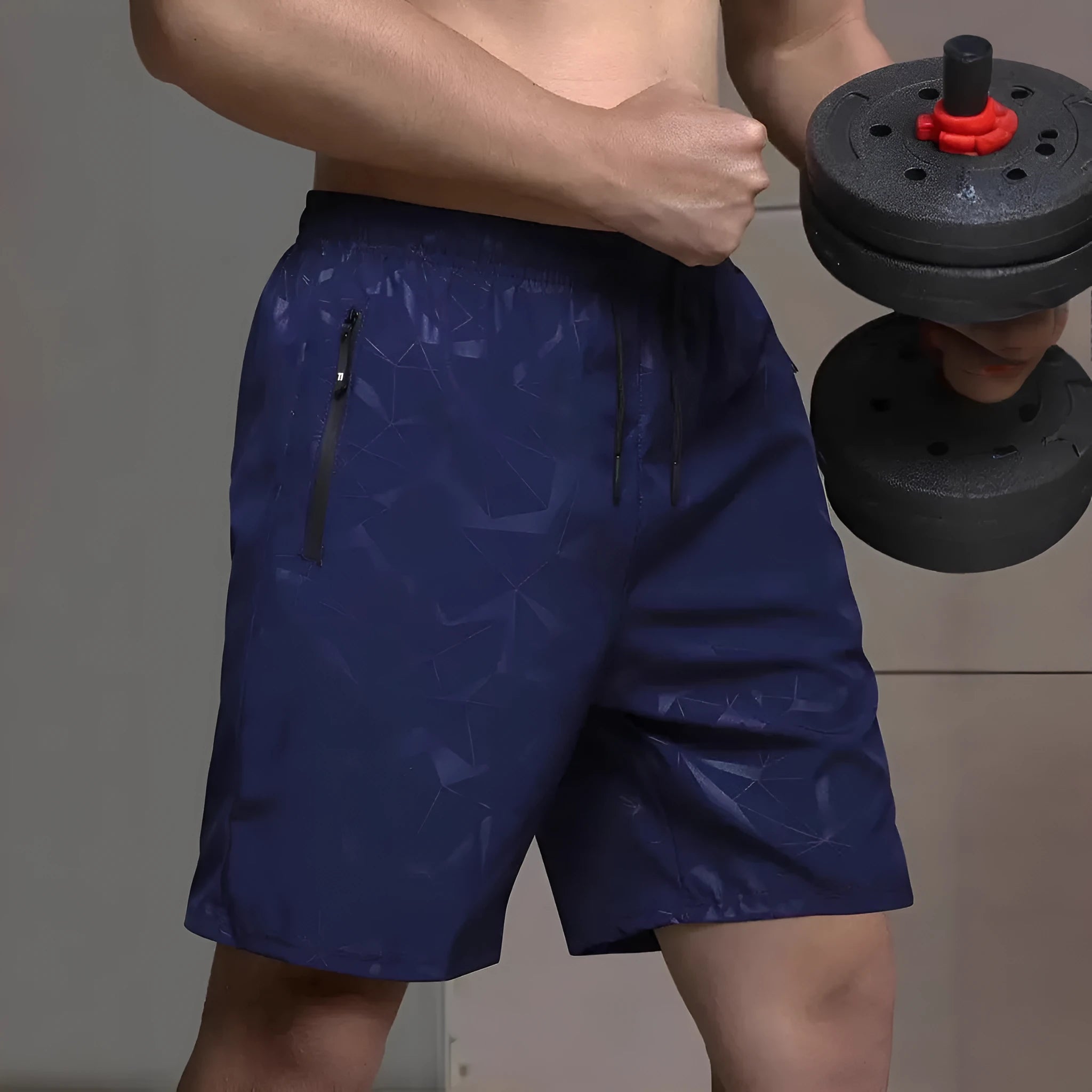 Man wearing loose black polyester sports shorts with an elastic waistband, suitable for gym or casual wear.