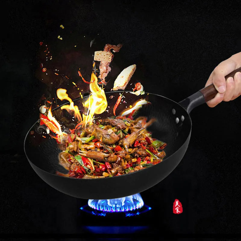 Traditional black iron wok with wooden handle measuring 32cm