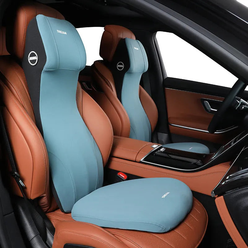 Black integrated memory foam car cushion and lumbar support pillow on a car seat.