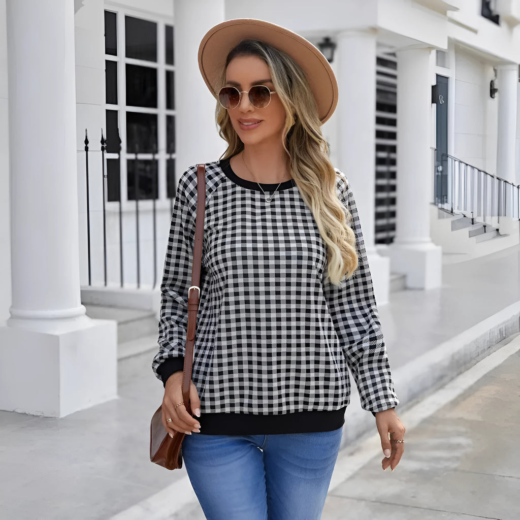 Black plaid striped long sleeve pullover sweater with printed design elements