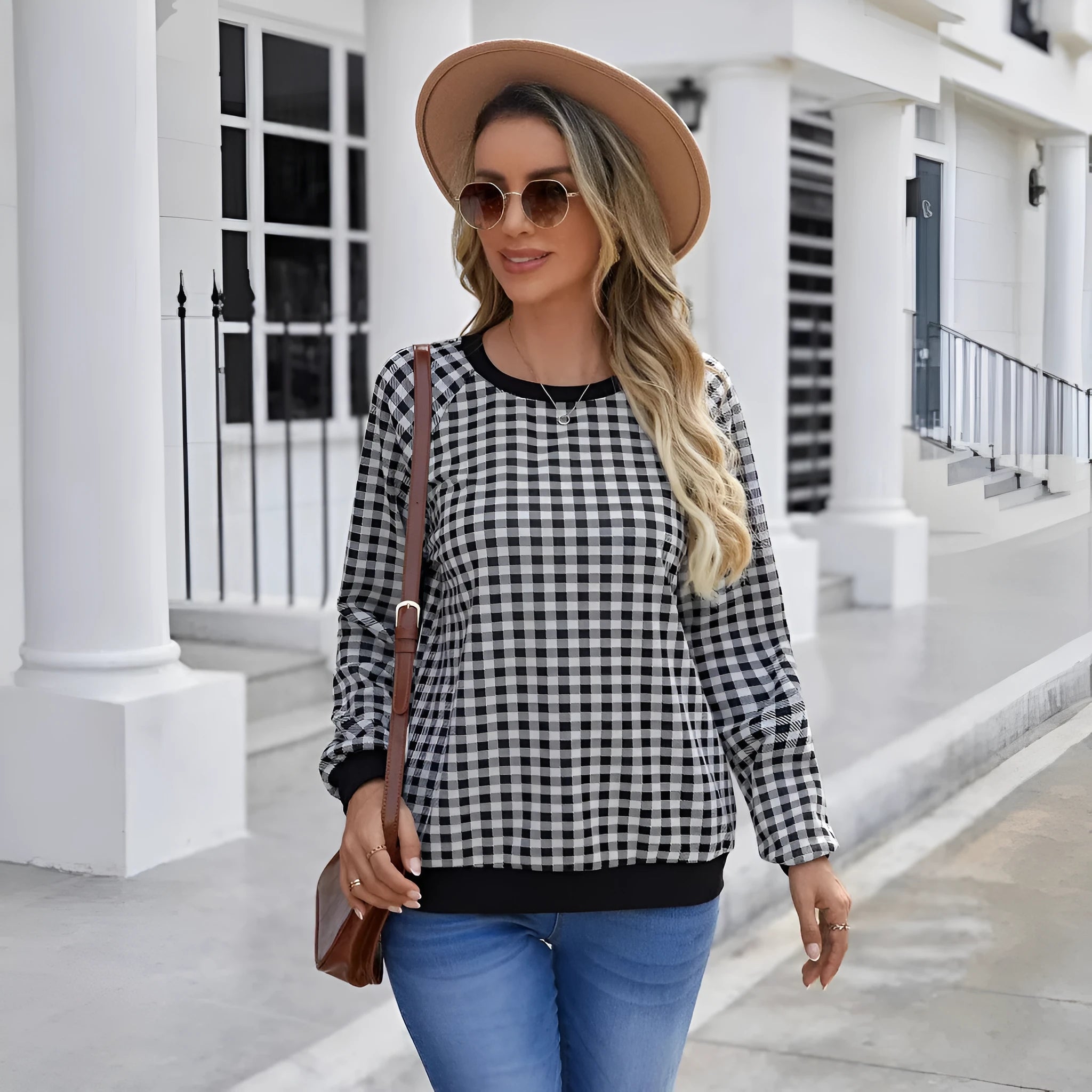 Black plaid striped long sleeve pullover sweater with printed design elements
