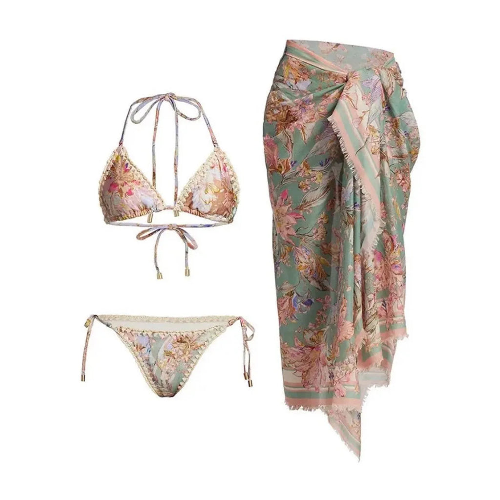 Creamy white floral print women's bikini set with matching skirt on a mannequin.