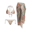 Creamy white floral print women's bikini set with matching skirt on a mannequin.