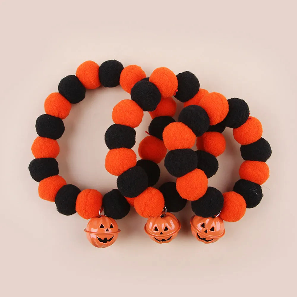 Orange Halloween pumpkin cat collar with adjustable buckle shown in small, medium, and large sizes