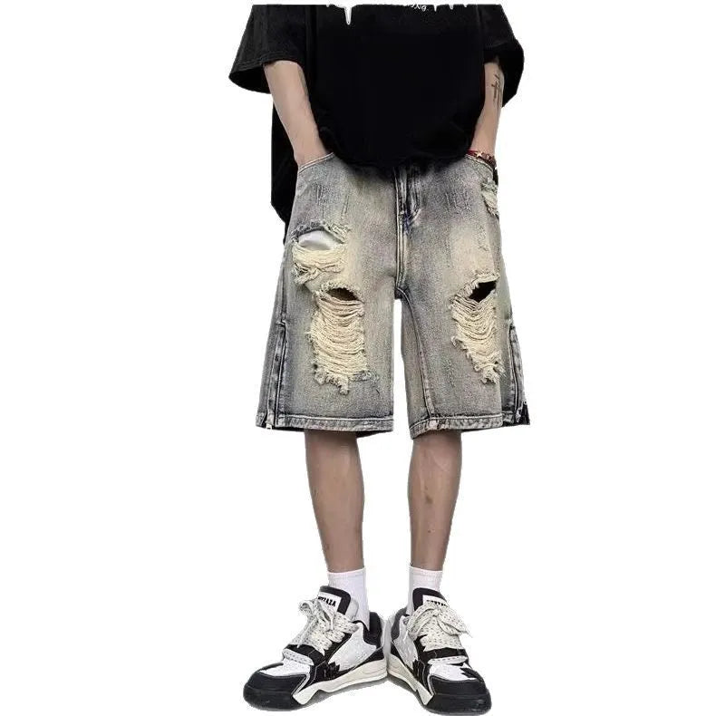 Blue retro tattered denim shorts with a wide leg loose fit on a mannequin.