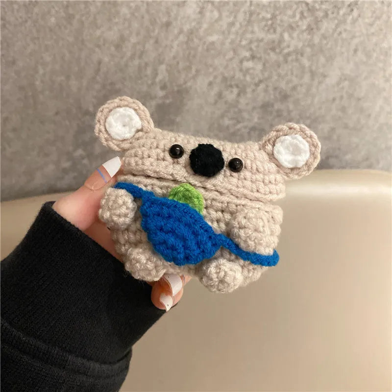 Handmade knitted AirPods protective cover with backpack koala bear design showing front and side views